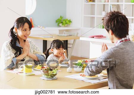 Young adult couple and their daughter having breakfast in their dining room View Large Photo Image Stock Image - Young adult couple and their daughter having breakfast in their dining room. Fotosearch