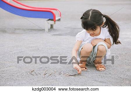 Picture - Young girl playing in the park. Fotosearch