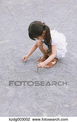 Young girl playing in the park View Large Photo Image Stock Image - Young girl playing in the park. Fotosearch