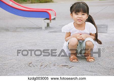 Young girl playing in the park View Large Photo Image Stock Photography - Young girl playing in the park. Fotosearch