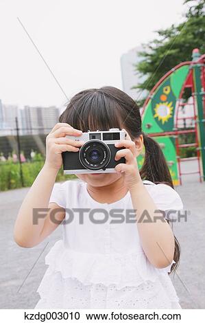Young girl with camera View Large Photo Image Stock Image - Young girl with camera. Fotosearch