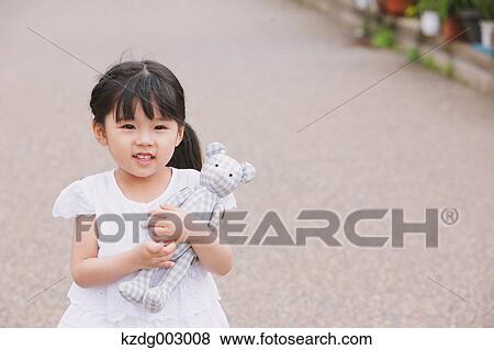 Young girl with teddy bear View Large Photo Image Stock Photo - Young girl with teddy bear. Fotosearch