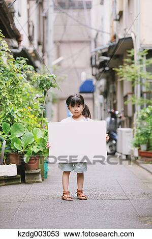 Young girl with whiteboard View Large Photo Image Stock Image - Young girl with whiteboard. Fotosearch