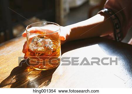 Young Japanese woman with glass of whiskey in a fashionable bar View Large Photo Image Picture - Young Japanese woman with glass of whiskey in a fashionable bar. Fotosearch