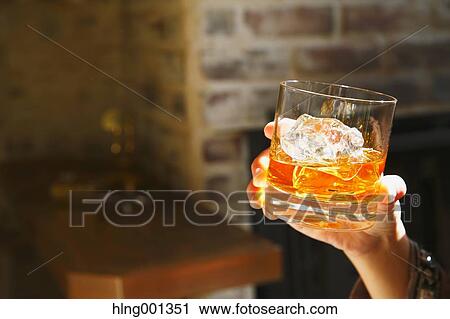 Young Japanese woman with glass of whiskey in a fashionable bar View Large Photo Image Stock Image - Young Japanese woman with glass of whiskey in a fashionable bar. Fotosearch