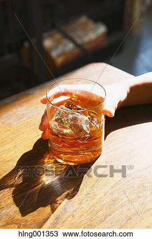 Young Japanese woman with glass of whiskey in a fashionable bar View Large Photo Image Stock Image - Young Japanese woman with glass of whiskey in a fashionable bar. Fotosearch