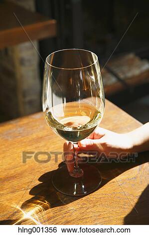 Young Japanese woman with glass of wine in a fashionable bar View Large Photo Image Stock Photograph - Young Japanese woman with glass of wine in a fashionable bar. Fotosearch