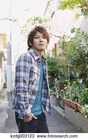 Young man looking at camera View Large Photo Image Stock Image - Young man looking at camera. Fotosearch
