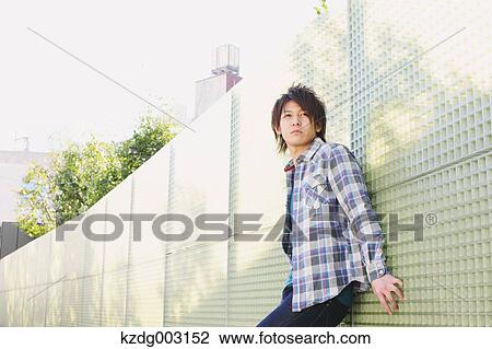 Young man looking at camera View Large Photo Image Stock Image - Young man looking at camera. Fotosearch