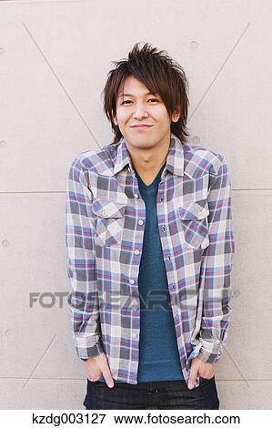 Young man looking at camera View Large Photo Image Stock Photo - Young man looking at camera. Fotosearch