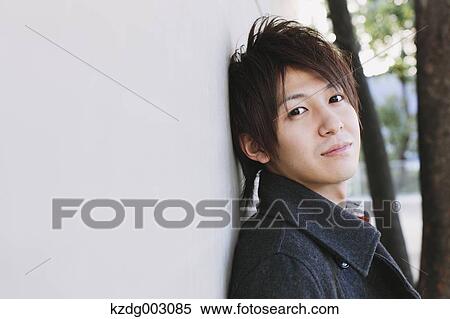Young man looking at camera View Large Photo Image Stock Photography - Young man looking at camera. Fotosearch