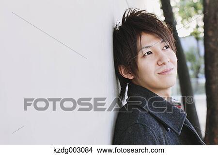Picture - Young man looking away. Fotosearch