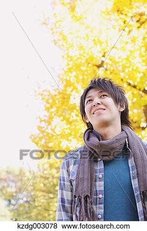 Stock Photo - Young man looking away. Fotosearch