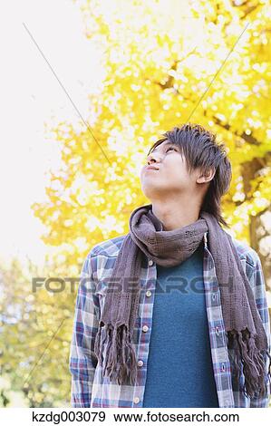 Young man looking away View Large Photo Image Stock Photo - Young man looking away. Fotosearch
