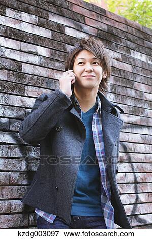 Stock Photo - Young man on the phone. Fotosearch
