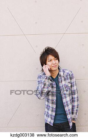 Young man on the phone View Large Photo Image Stock Photo - Young man on the phone. Fotosearch