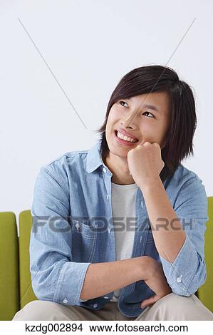 Young man on the sofa View Large Photo Image Picture - Young man on the sofa. Fotosearch