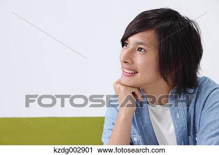 Young man on the sofa View Large Photo Image Stock Image - Young man on the sofa. Fotosearch