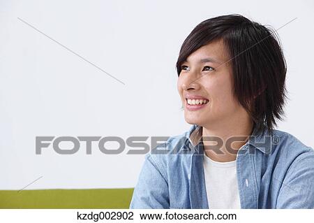Young man on the sofa View Large Photo Image Stock Image - Young man on the sofa. Fotosearch