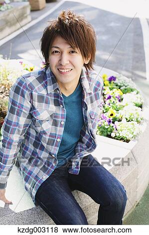 Young man smiling at camera View Large Photo Image Stock Photo - Young man smiling at camera. Fotosearch