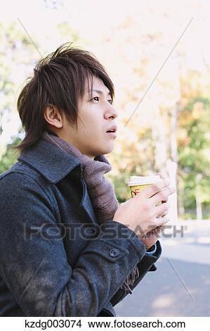Young man with coffee View Large Photo Image Picture - Young man with coffee. Fotosearch