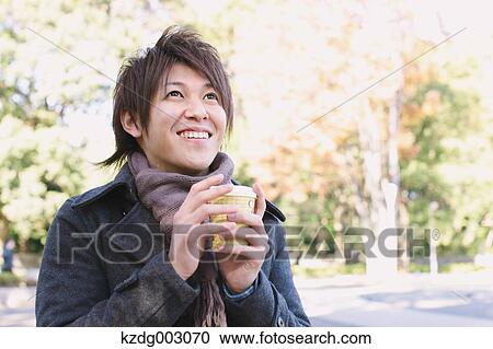 Young man with coffee View Large Photo Image Stock Image - Young man with coffee. Fotosearch