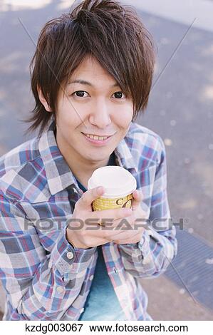 Stock Photo - Young man with coffee. Fotosearch
