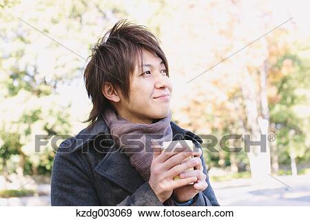 Stock Photo - Young man with coffee. Fotosearch