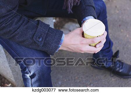 Stock Photo - Young man with coffee. Fotosearch