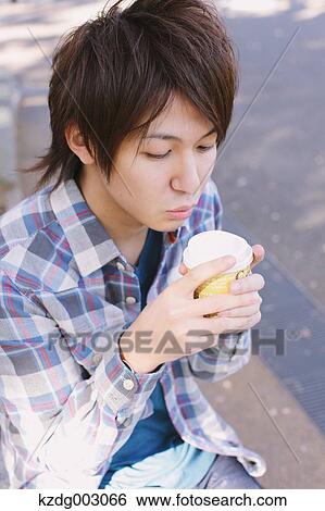 Young man with coffee View Large Photo Image Stock Photograph - Young man with coffee. Fotosearch