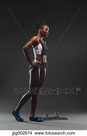 Picture - African Female Athlete Exercising, Studio Shot. Fotosearch