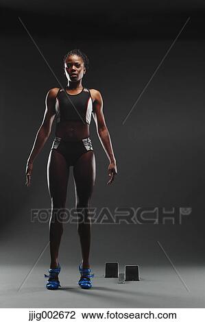 African Female Athlete Exercising, Studio Shot View Large Photo Image Stock Image - African Female Athlete Exercising, Studio Shot. Fotosearch