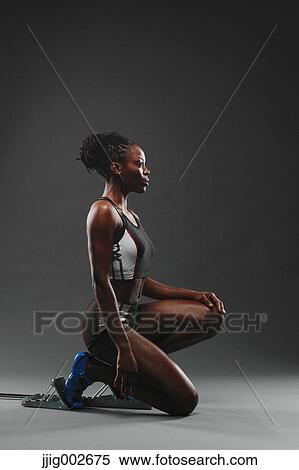 African Woman Runner at Starting Block View Large Photo Image Stock Photography - African Woman Runner at Starting Block. Fotosearch