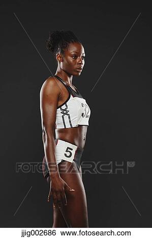 Stock Photograph - African Woman Runner, Focused . Fotosearch