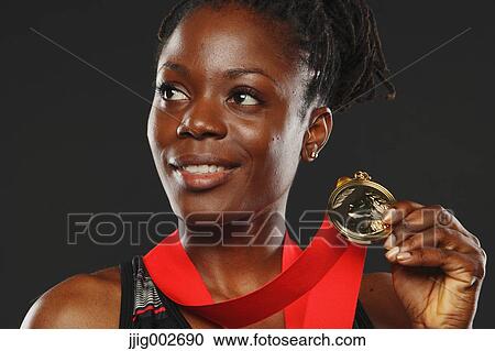 African Woman Showing Medal and Smiling View Large Photo Image Stock Image - African Woman Showing Medal and Smiling. Fotosearch