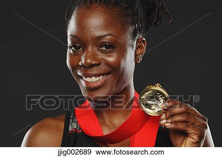 African Woman Showing Medal and Smiling View Large Photo Image Stock Photo - African Woman Showing Medal and Smiling. Fotosearch