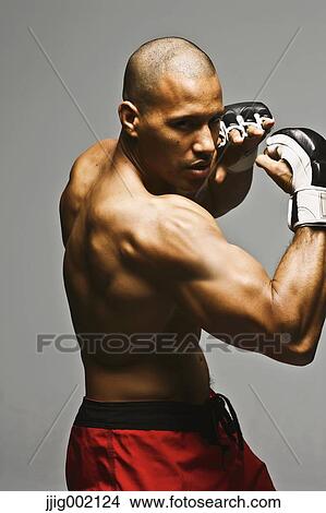 Bald male athlete in a fighting pose View Large Photo Image Picture - Bald male athlete in a fighting pose. Fotosearch