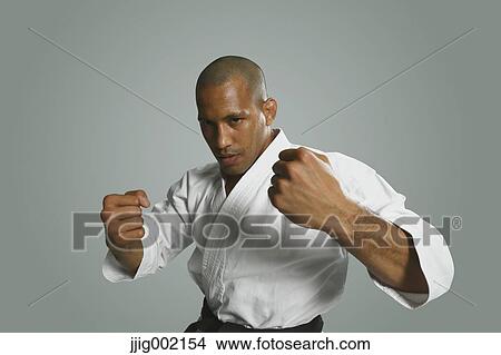 Bald male athlete in a fighting pose View Large Photo Image Picture - Bald male athlete in a fighting pose. Fotosearch