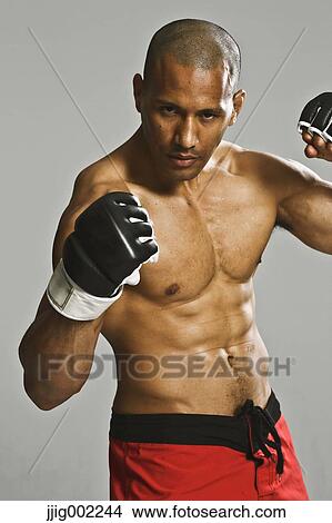 Bald male athlete in a fighting pose View Large Photo Image Picture - Bald male athlete in a fighting pose. Fotosearch