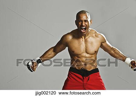 Bald male athlete in a fighting pose View Large Photo Image Stock Image - Bald male athlete in a fighting pose. Fotosearch
