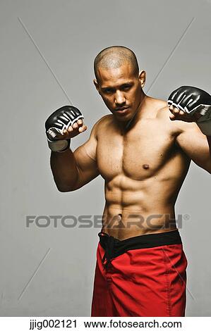 Bald male athlete in a fighting pose View Large Photo Image Stock Image - Bald male athlete in a fighting pose. Fotosearch