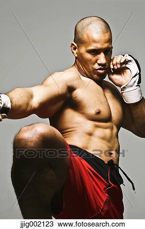 Bald male athlete in a fighting pose View Large Photo Image Stock Image - Bald male athlete in a fighting pose. Fotosearch