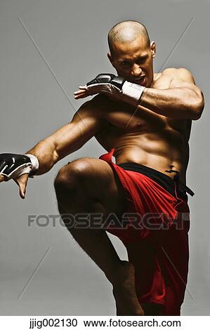 Bald male athlete in a fighting pose View Large Photo Image Stock Image - Bald male athlete in a fighting pose. Fotosearch