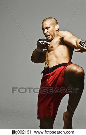 Bald male athlete in a fighting pose View Large Photo Image Stock Image - Bald male athlete in a fighting pose. Fotosearch