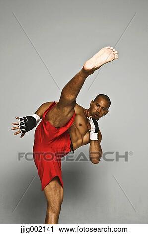 Bald male athlete in a fighting pose View Large Photo Image Stock Image - Bald male athlete in a fighting pose. Fotosearch