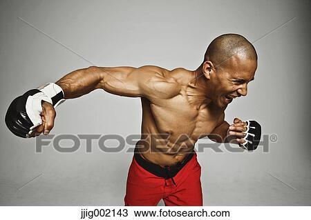 Bald male athlete in a fighting pose View Large Photo Image Stock Image - Bald male athlete in a fighting pose. Fotosearch