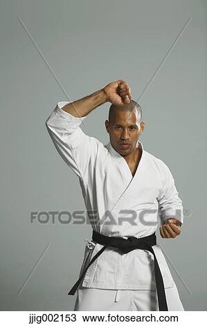 Bald male athlete in a fighting pose View Large Photo Image Stock Image - Bald male athlete in a fighting pose. Fotosearch