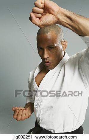 Bald male athlete in a fighting pose View Large Photo Image Stock Image - Bald male athlete in a fighting pose. Fotosearch
