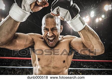Stock Photo - Bald male athlete in a fighting pose. Fotosearch