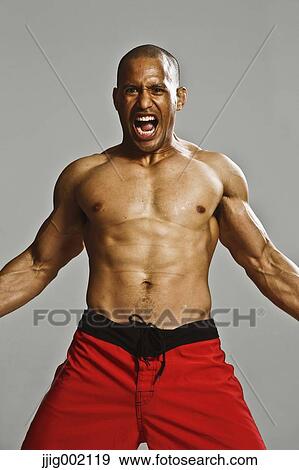 Bald male athlete in a fighting pose View Large Photo Image Stock Photo - Bald male athlete in a fighting pose. Fotosearch